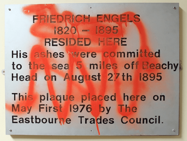 Engels 1976 plaque with graffiti; 2021.